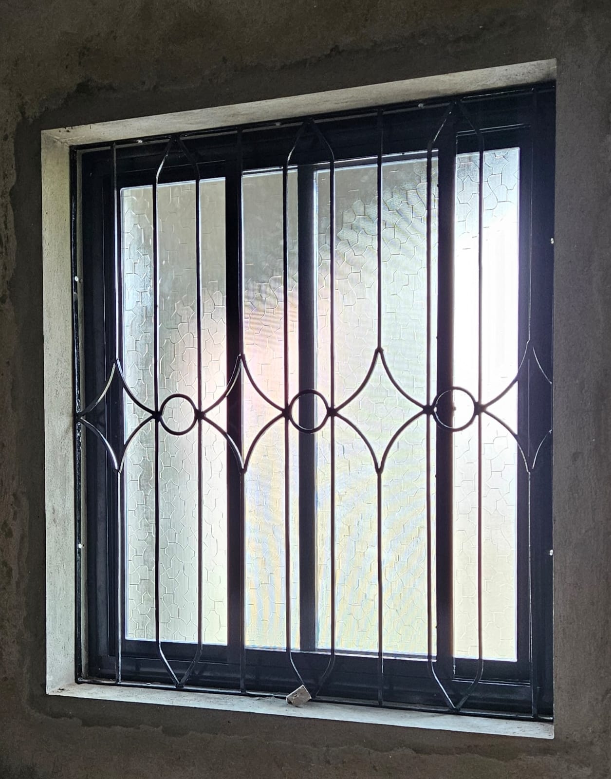 Aluminium sliding window with iron grill
